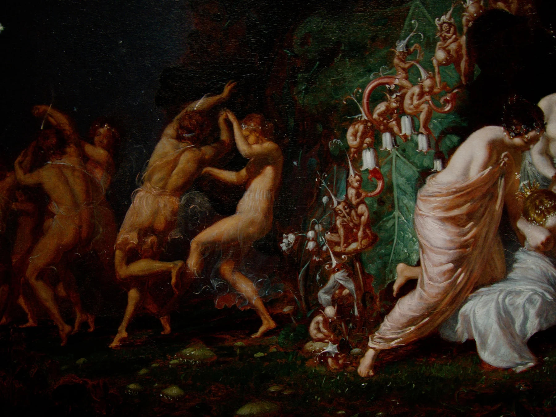Titania asleep among flowers and fairies